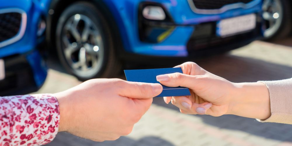 Blue business car with shiny front lights color bright