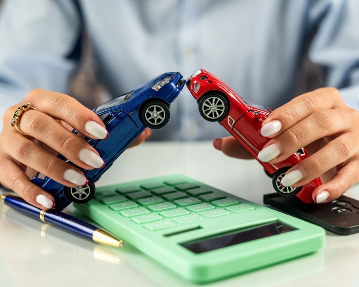 Car dealer woman businesswoman signing car insurance document or rental paper.