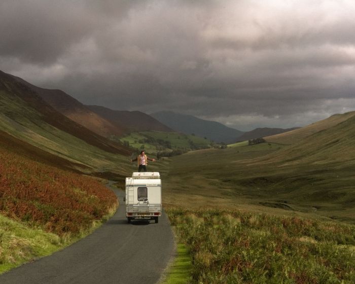 man-standing-van-against-sky