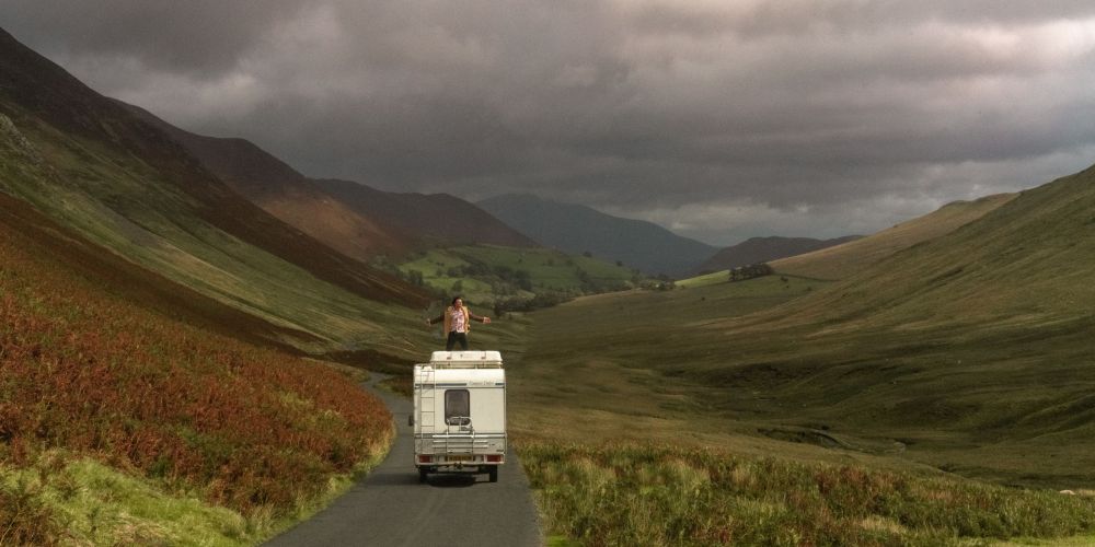 man-standing-van-against-sky