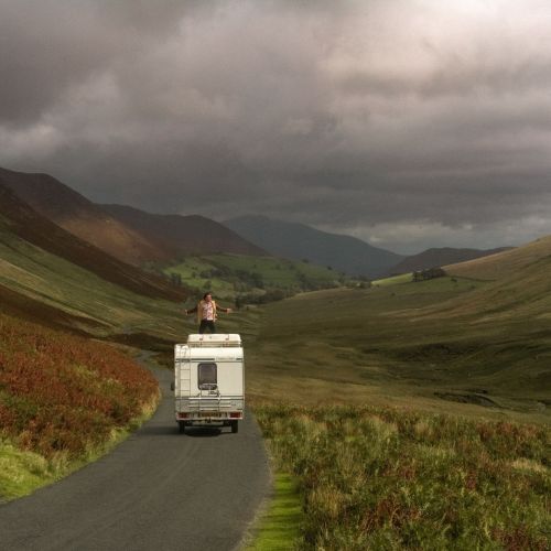 man-standing-van-against-sky