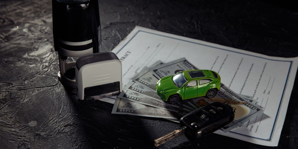 Purchase contract for a car with stamps, keys and toy car