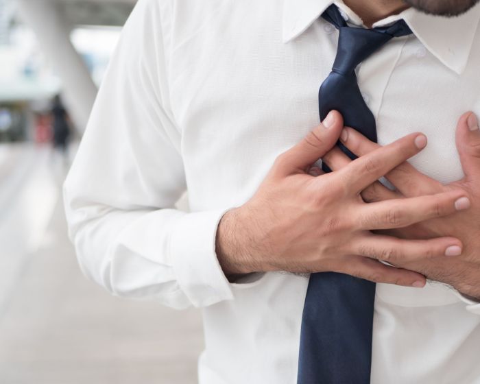 sick asian man suffering from heart attack, seisure