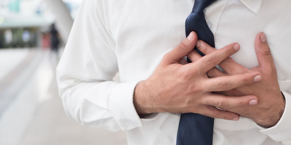sick asian man suffering from heart attack, seisure